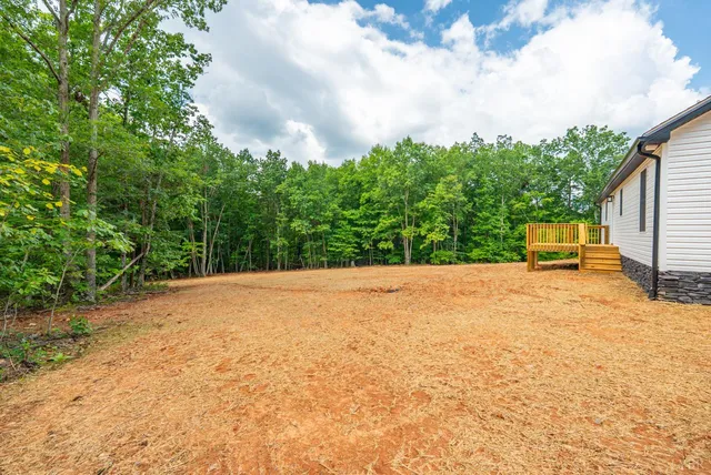 a view of deck and a yard
