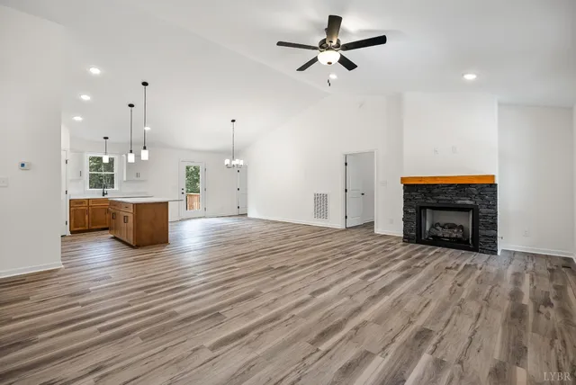 a view of a kitchen with furniture and a fireplace