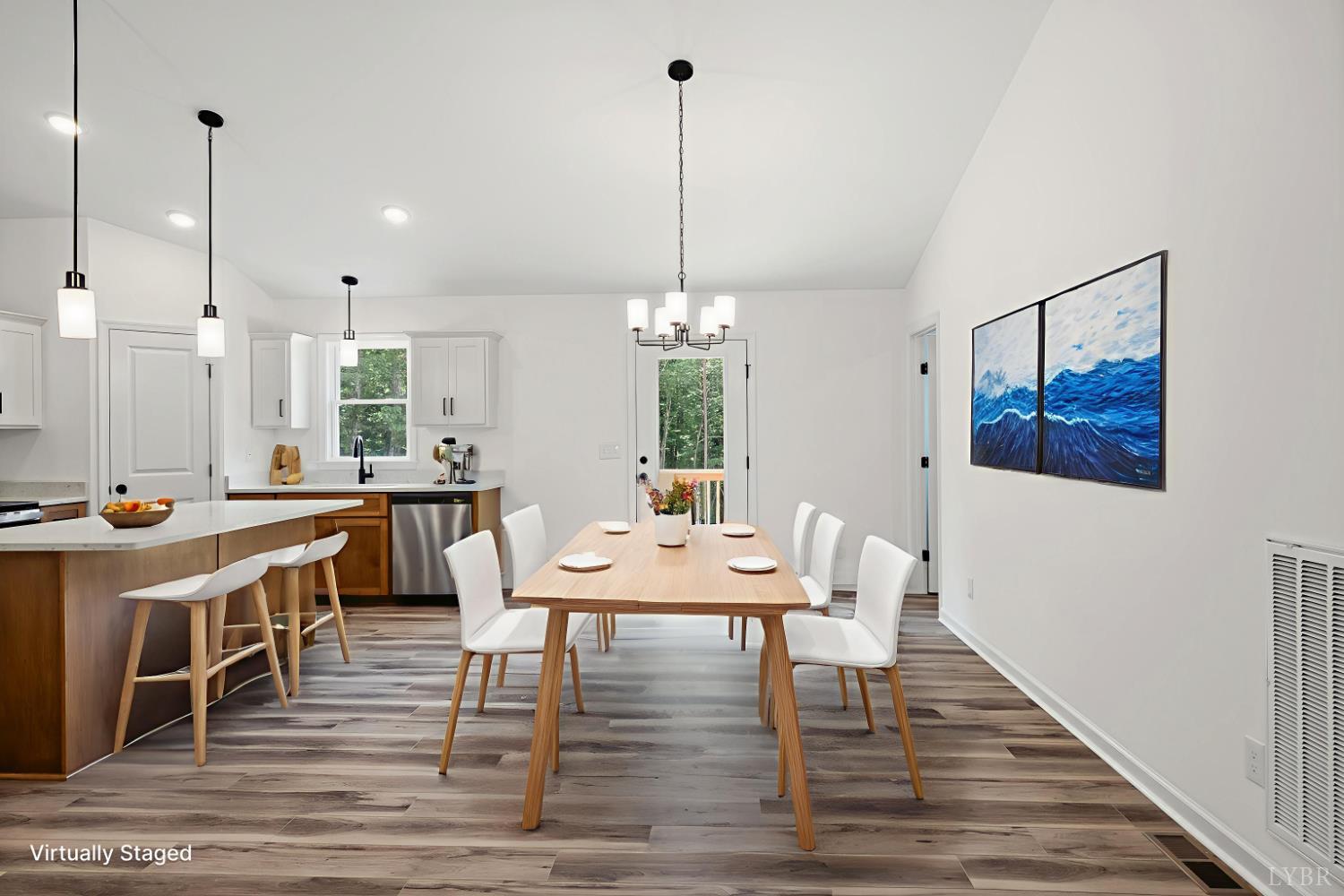 2541 Mitchell Mill Road Gladys, VA 24554 - Photo 43 of 44 a view of a dining room and livingroom with furniture wooden floor a chandelier
