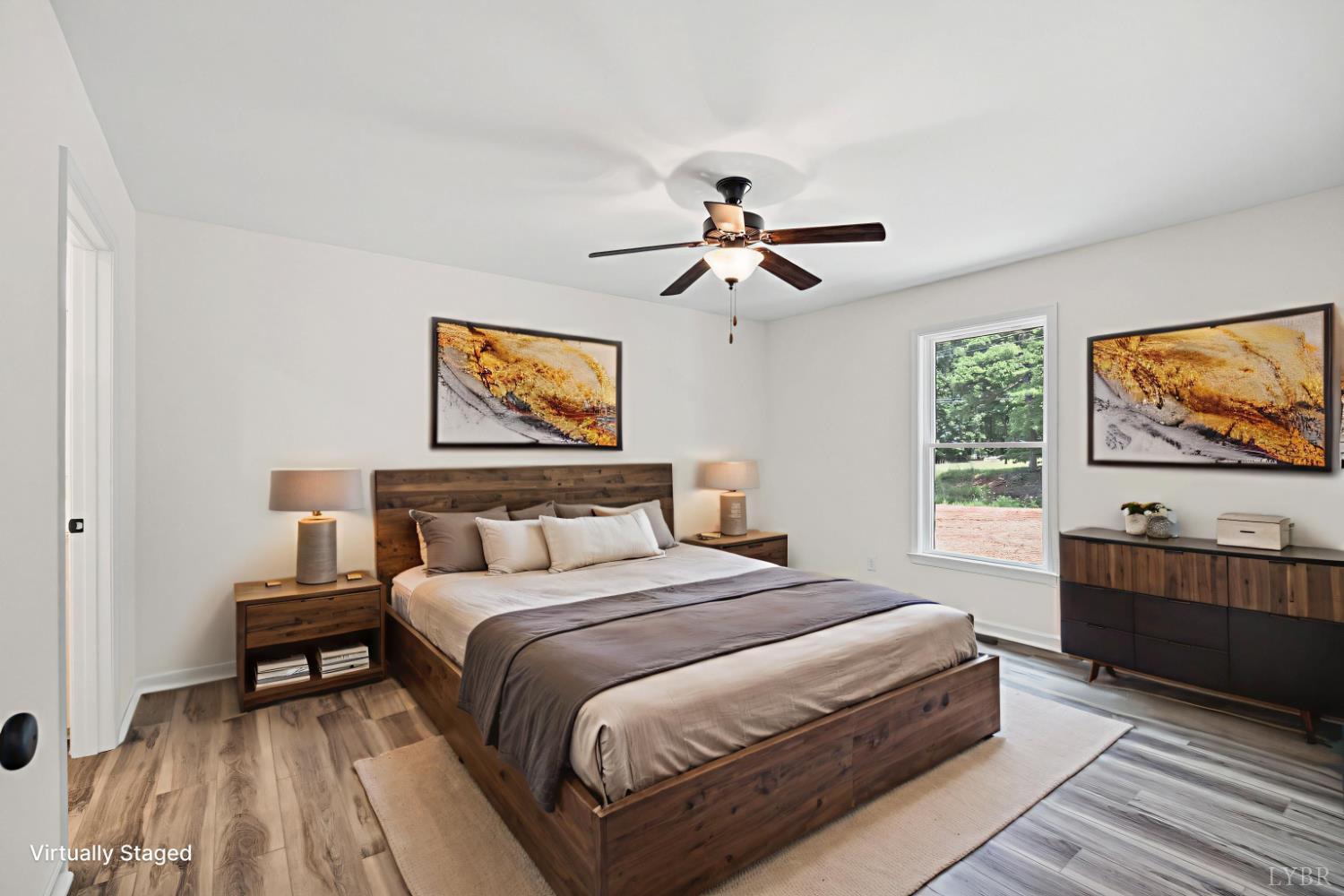 2541 Mitchell Mill Road Gladys, VA 24554 - Photo 44 of 44 a bedroom with a bed and a flat screen tv