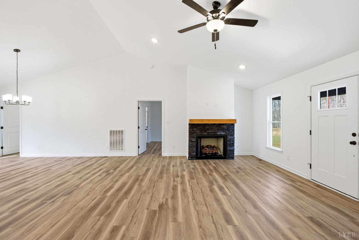 2541 Mitchell Mill Road Gladys, VA 24554 - Photo 5 of 41 a view of empty room with a fireplace and fan