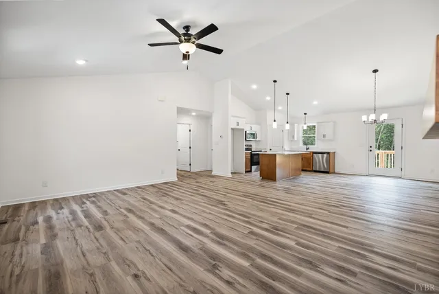 a view of a kitchen with a dishwasher and wooden floor