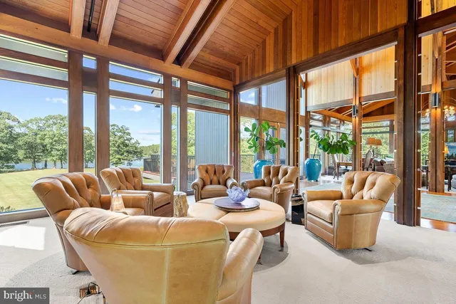a dining room with furniture and a chandelier