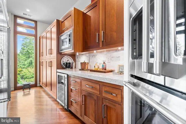 a dining room with furniture and a chandelier