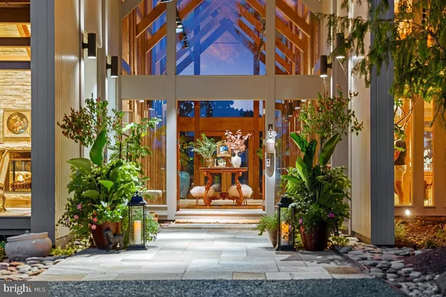 a view of a dining room with furniture and a window