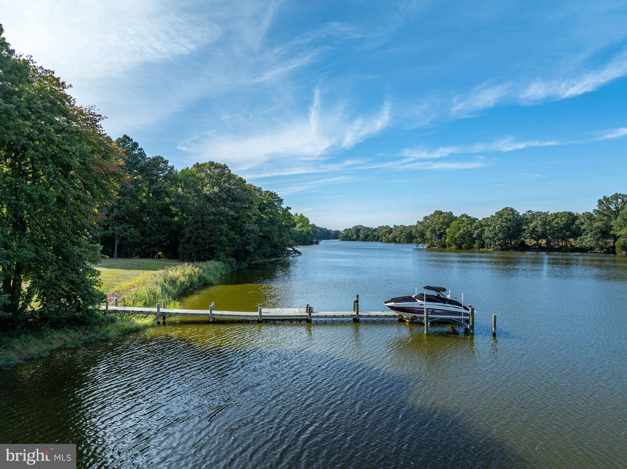 27772 Sharp Road Easton, MD 21601 - Photo 79 of 86 a view of a lake with houses in the back