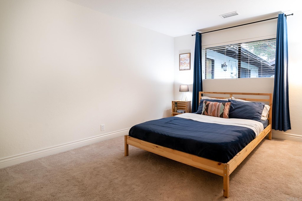 3342 White Hawk Road Escondido, CA 92027 - Photo 33 of 63 a bedroom with a bed and window