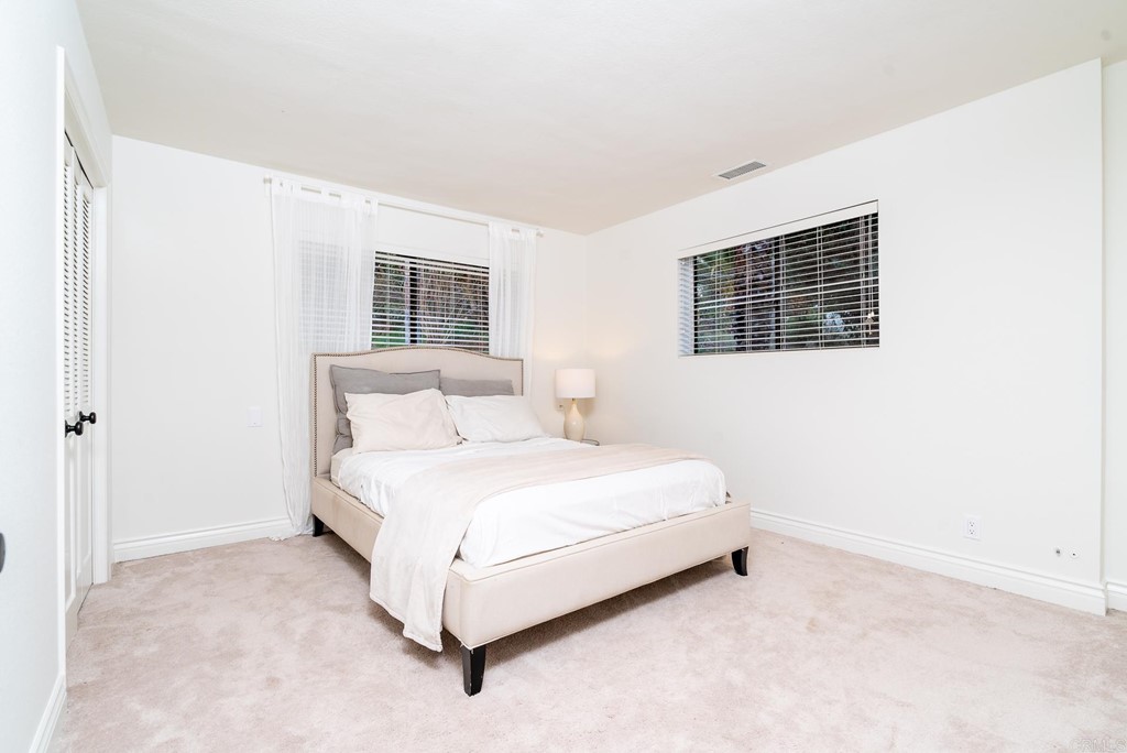 3342 White Hawk Road Escondido, CA 92027 - Photo 34 of 63 a bed room with a bed and a night stand