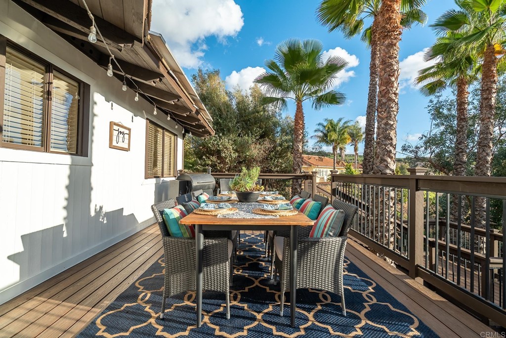 3342 White Hawk Road Escondido, CA 92027 - Photo 39 of 63 a view of a patio with a table and chairs and potted plants