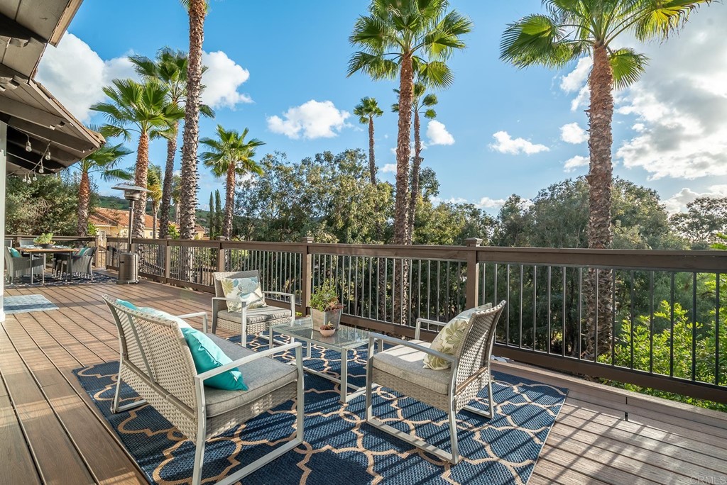 3342 White Hawk Road Escondido, CA 92027 - Photo 41 of 63 a view of a patio with a table chairs and a potted plant