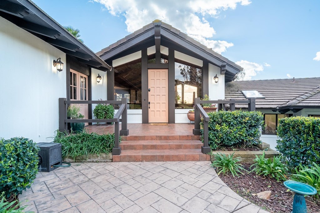 3342 White Hawk Road Escondido, CA 92027 - Photo 8 of 63 a front view of a house with plants and flowers