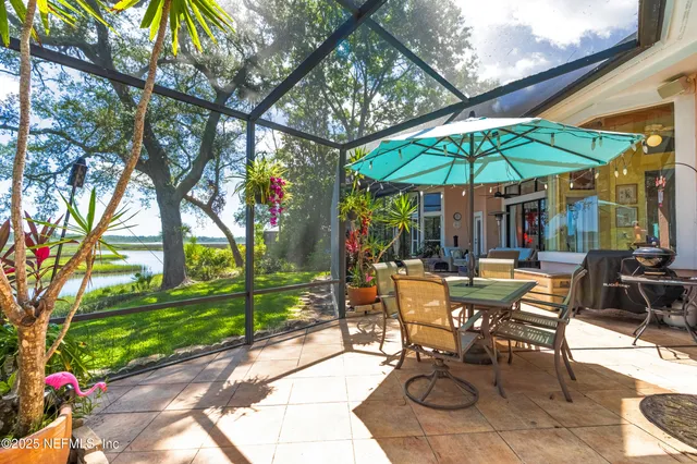 a kitchen with granite countertop a sink and stainless steel appliances
