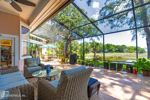 a large white kitchen with a large window