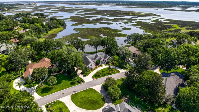 a view of a street with a big yard