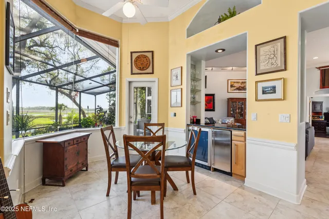 a bedroom with a bed couch and a window