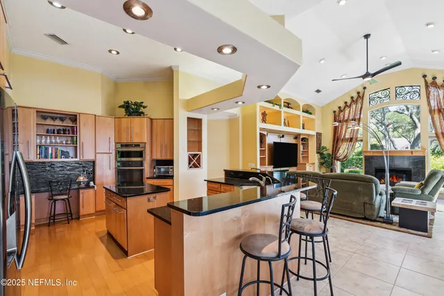 a bedroom with two beds and a large window
