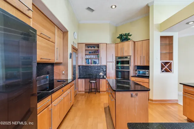 a bedroom with furniture and a flat screen tv
