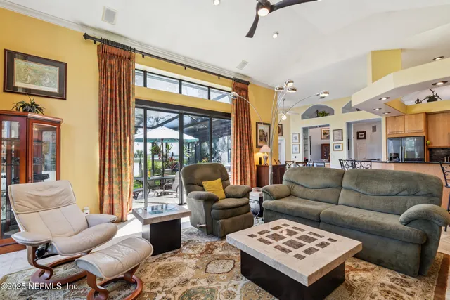 an aerial view of a house with a yard basket ball court and outdoor seating