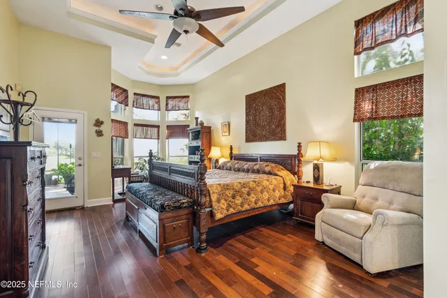 a view of a swimming pool with a patio and plants