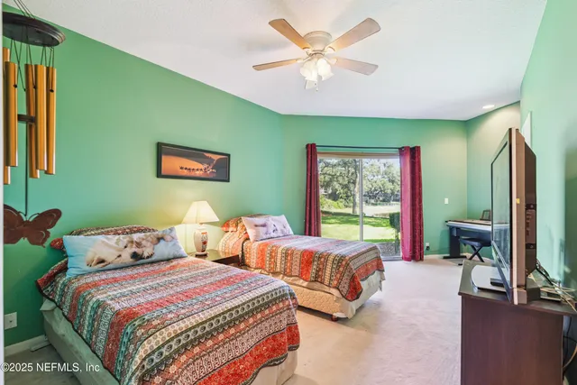 a view of swimming pool with a yard and plants