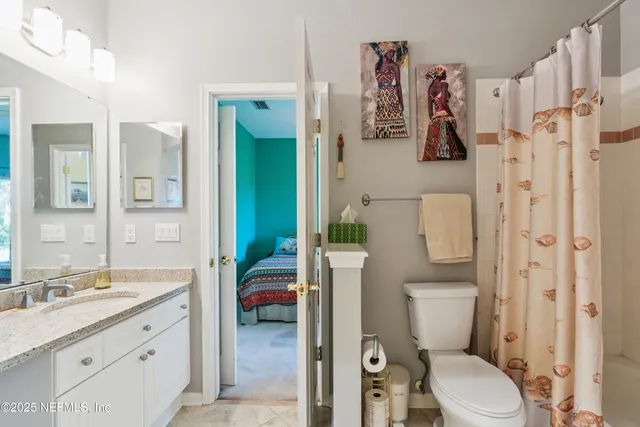 an aerial view of a house with garden space and street view