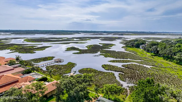 a front view of a house with a yard outdoor seating and garage