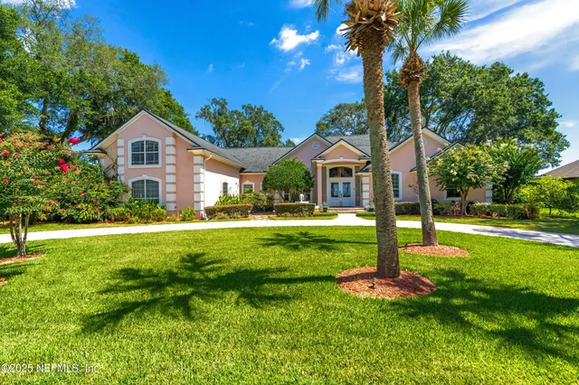 a view of a lake with a yard