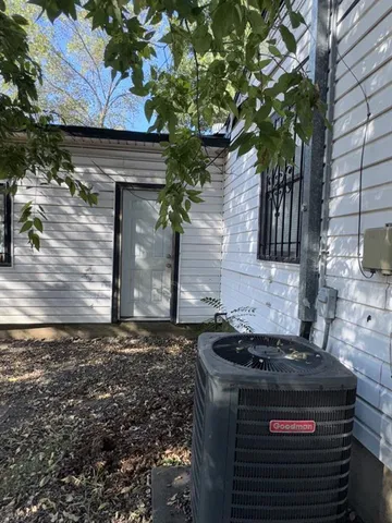 a stove top oven sitting inside of a kitchen