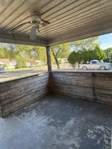 a view of room with window and a ceiling fan