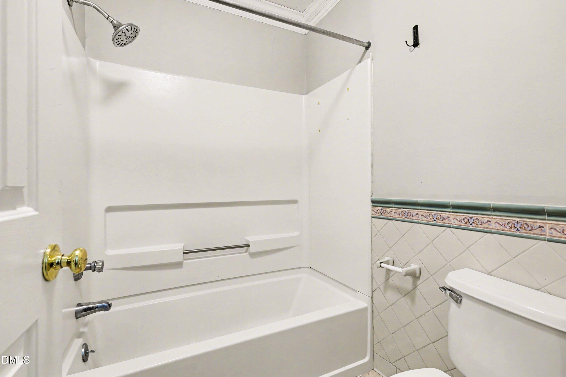5645 Hamstead Crossing Raleigh, NC 27612 - Photo 21 of 35 a bathroom with a bathtub and a shower