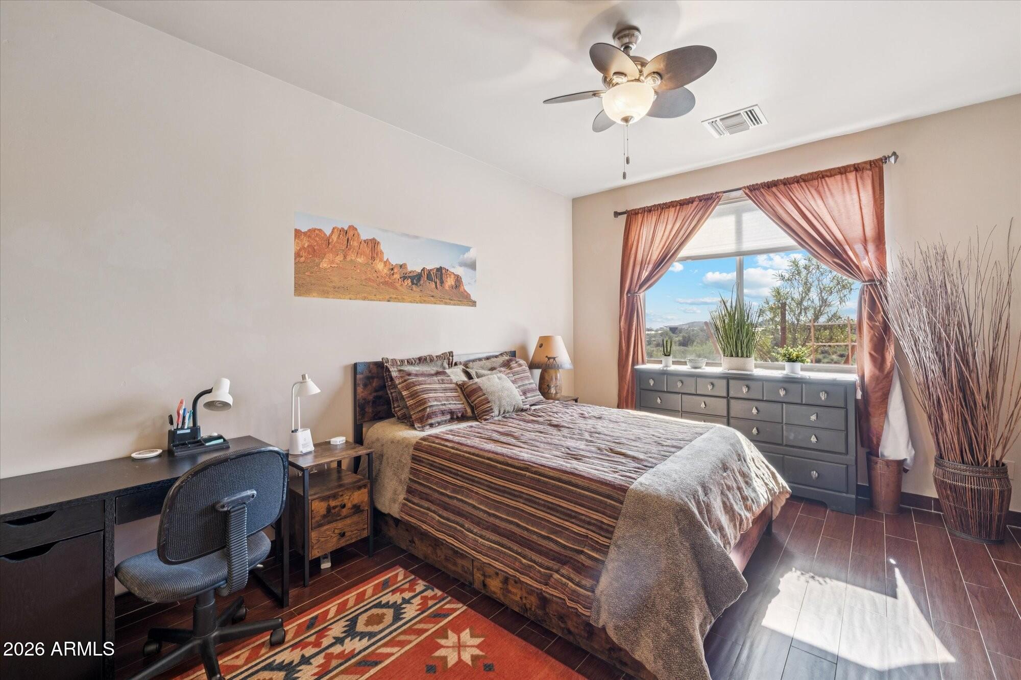 30012 North 170th Street Rio Verde, AZ 85263 - Photo 13 of 32 a bedroom with a bed and a chandelier