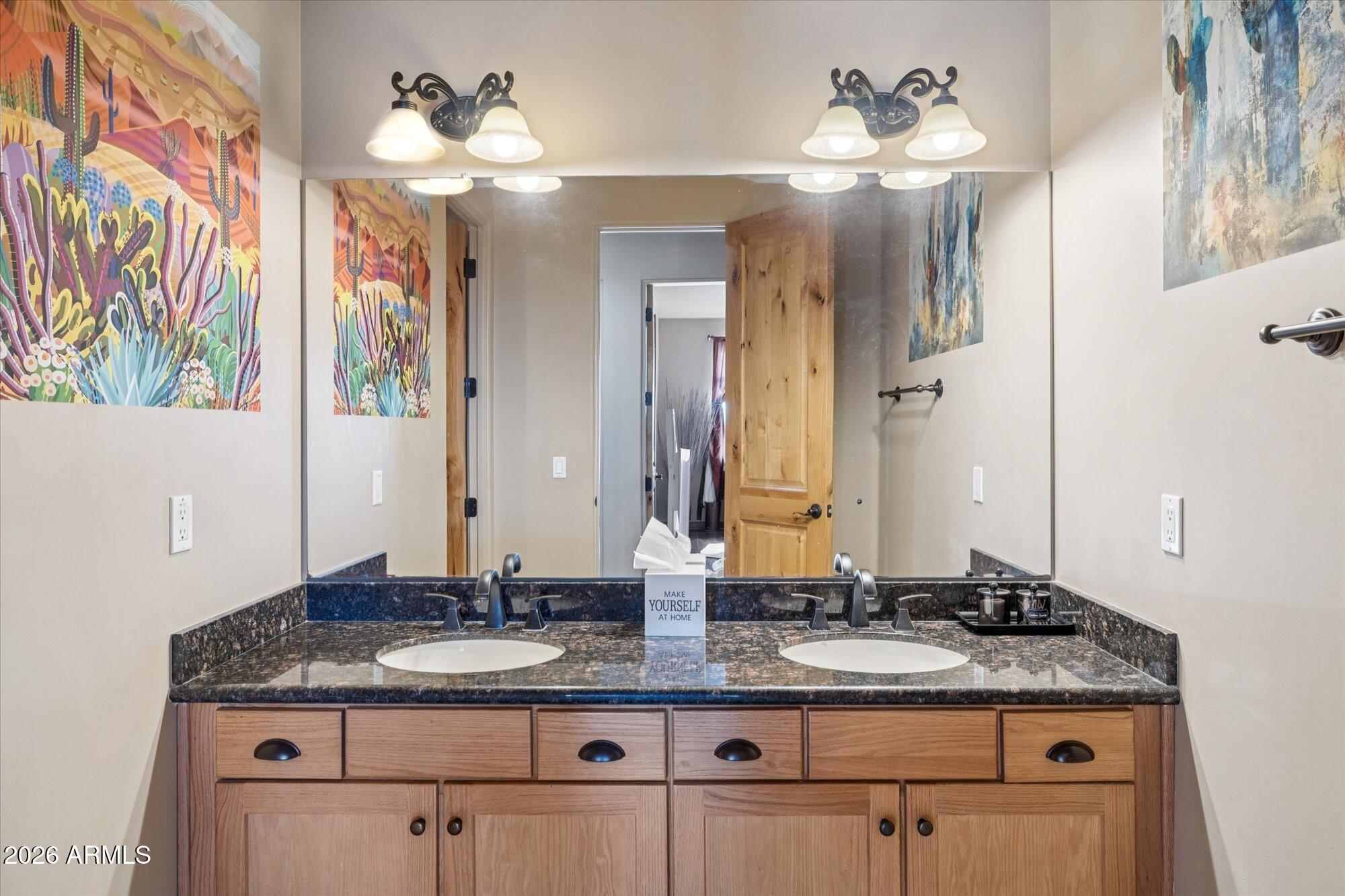 30012 North 170th Street Rio Verde, AZ 85263 - Photo 14 of 32 a bathroom with a granite countertop sink and a mirror