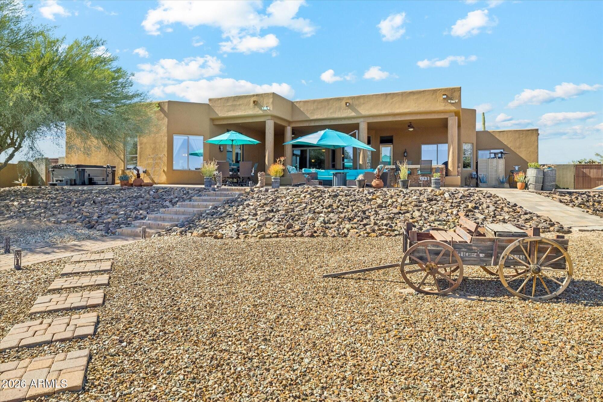 30012 North 170th Street Rio Verde, AZ 85263 - Photo 24 of 32 a view of a backyard with a garden and entertaining space