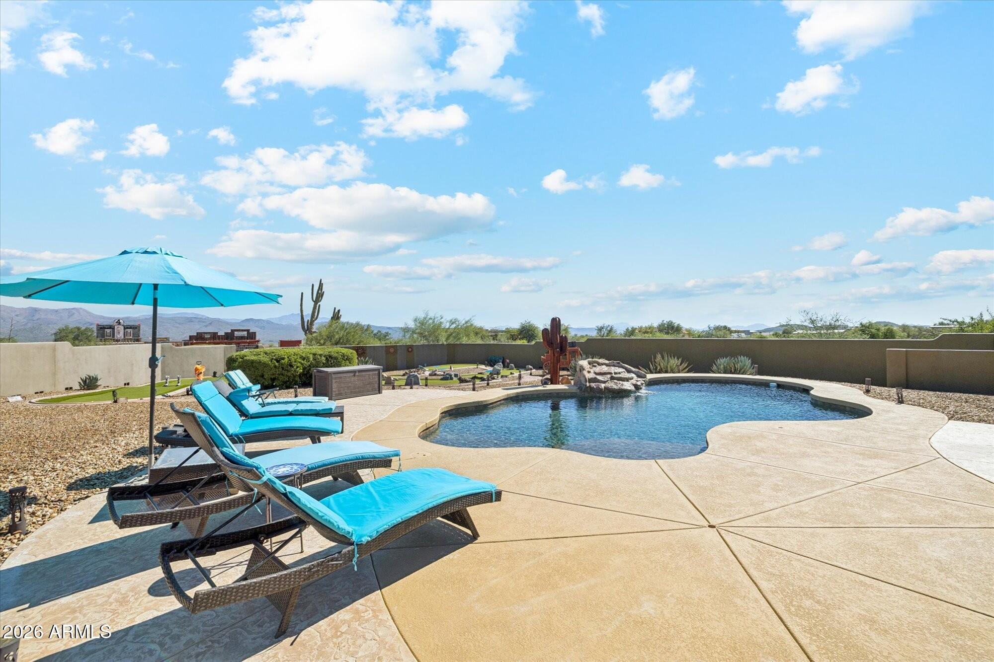 30012 North 170th Street Rio Verde, AZ 85263 - Photo 25 of 32 a view of a swimming pool with lounge chairs