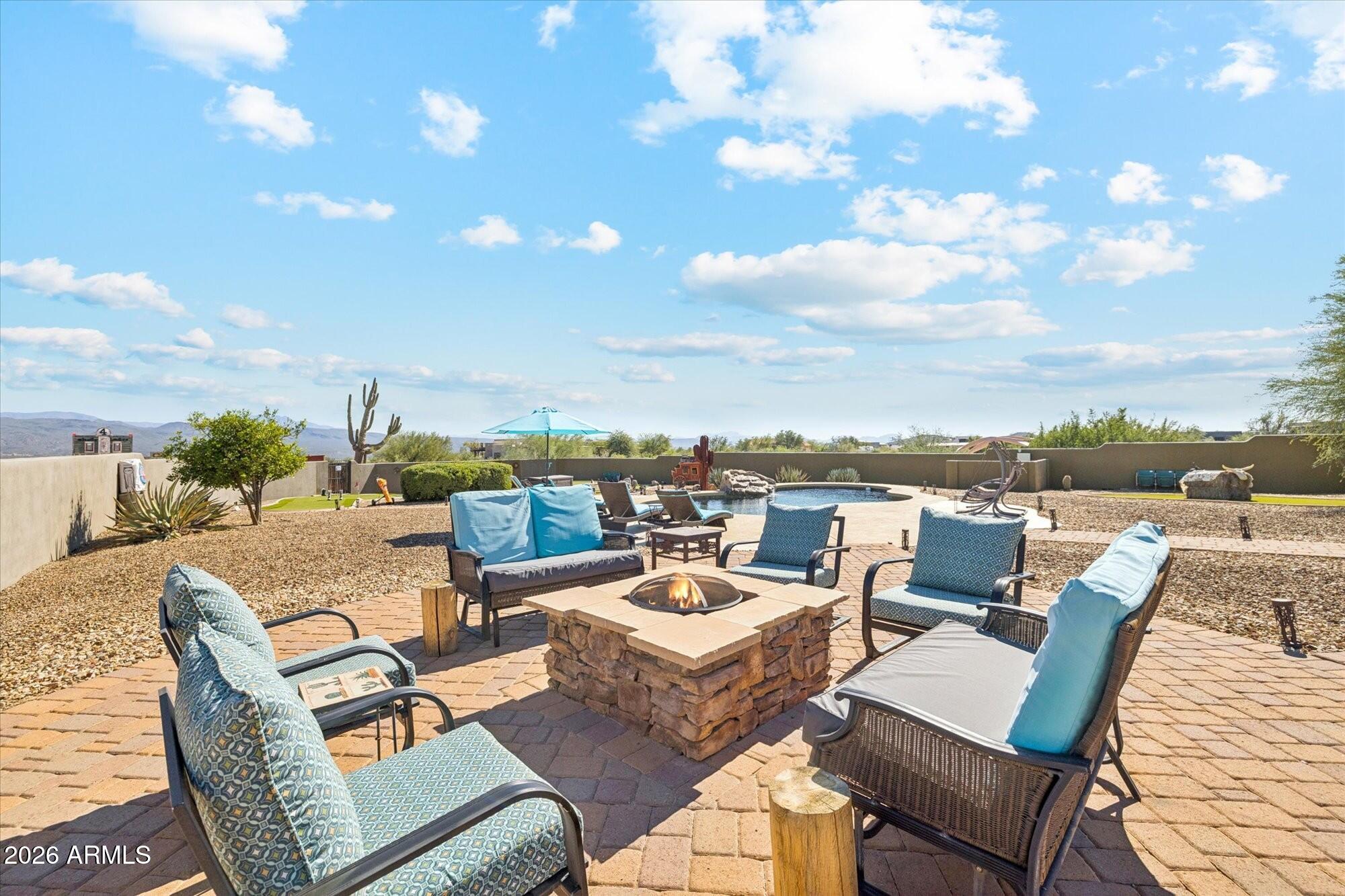 30012 North 170th Street Rio Verde, AZ 85263 - Photo 27 of 32 a view of a roof deck with couches and potted plants