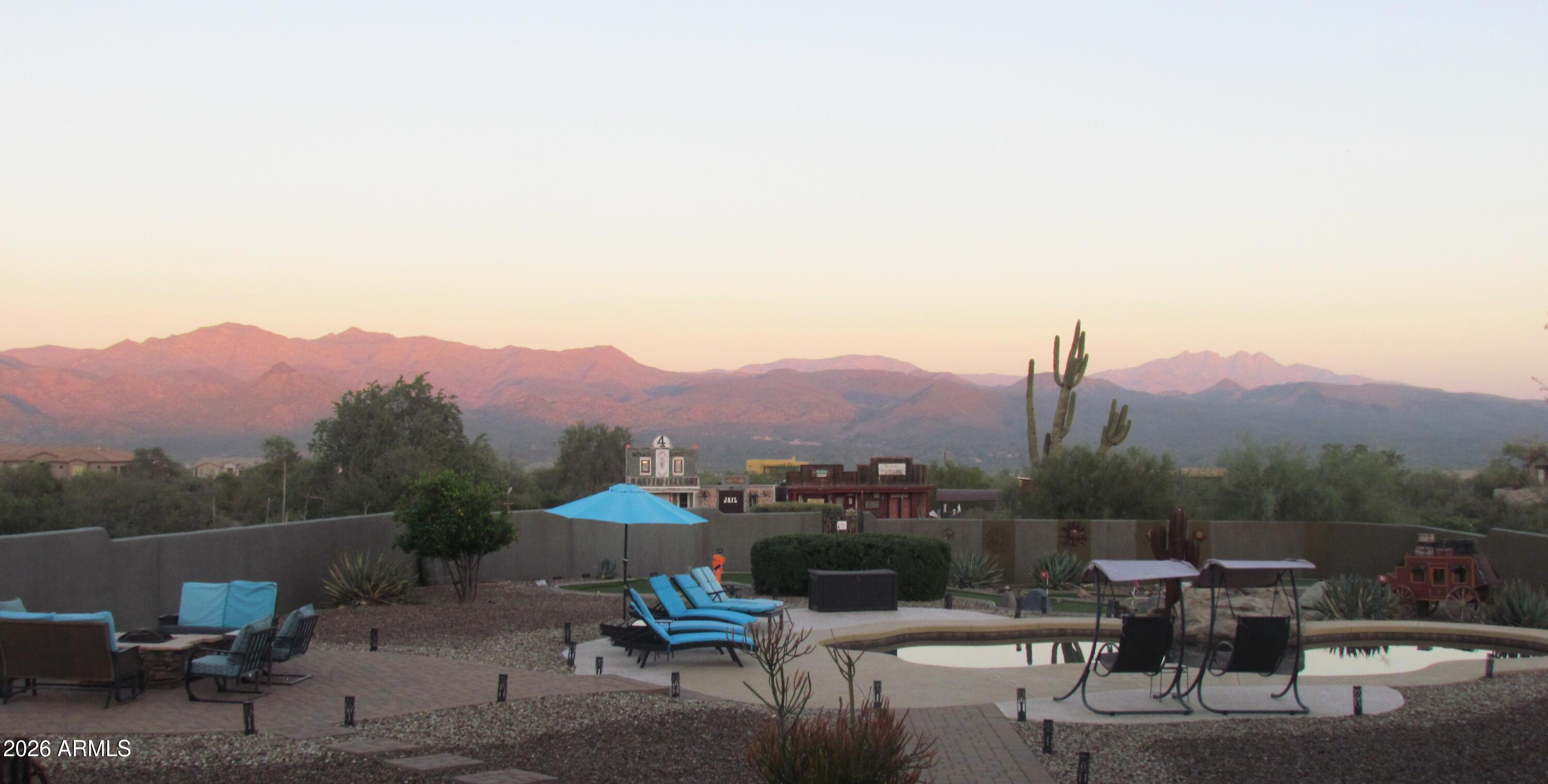 30012 North 170th Street Rio Verde, AZ 85263 - Photo 3 of 32 a view of a terrace with a table and chairs