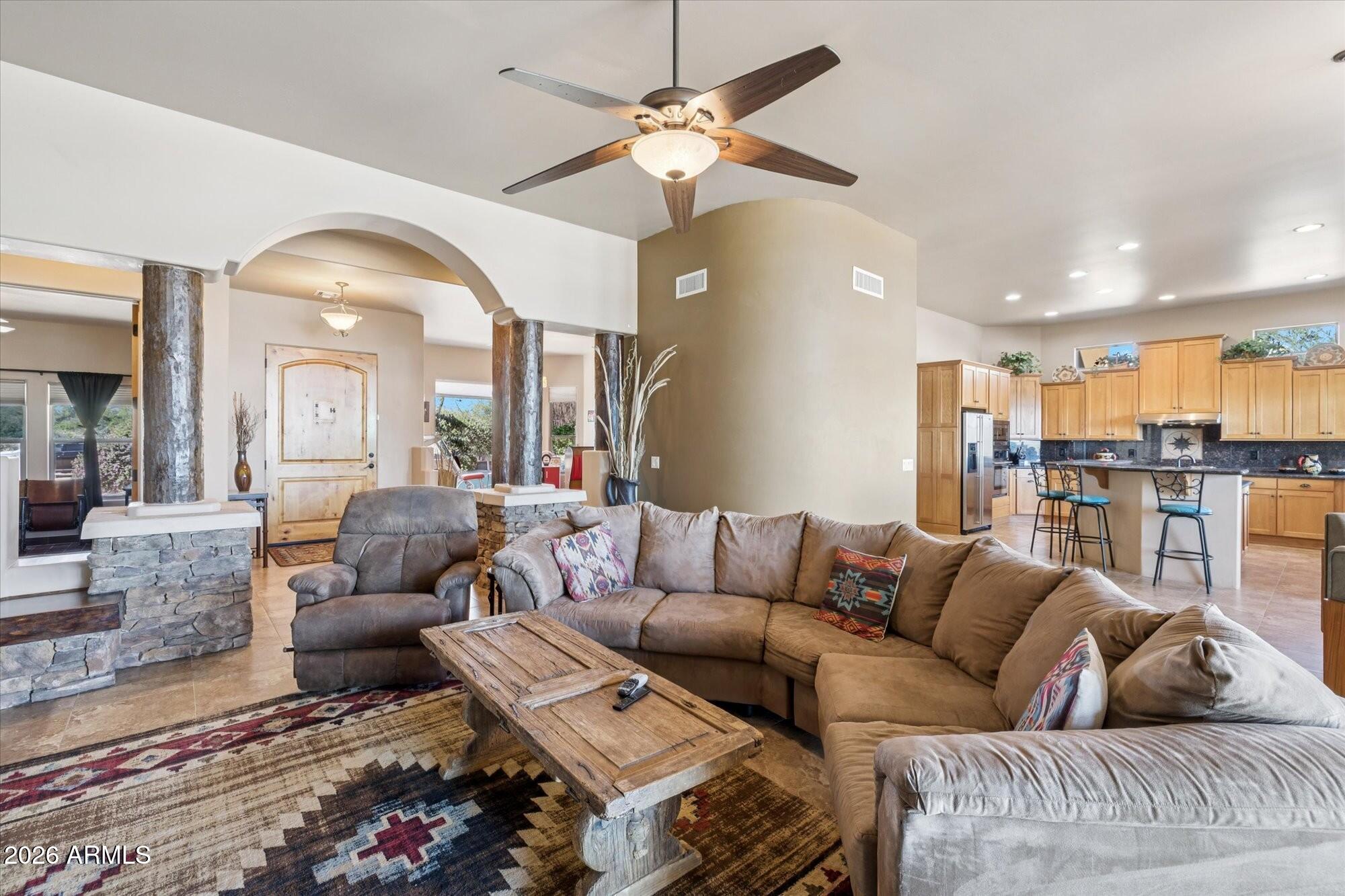 30012 North 170th Street Rio Verde, AZ 85263 - Photo 5 of 32 a living room with furniture and a chandelier
