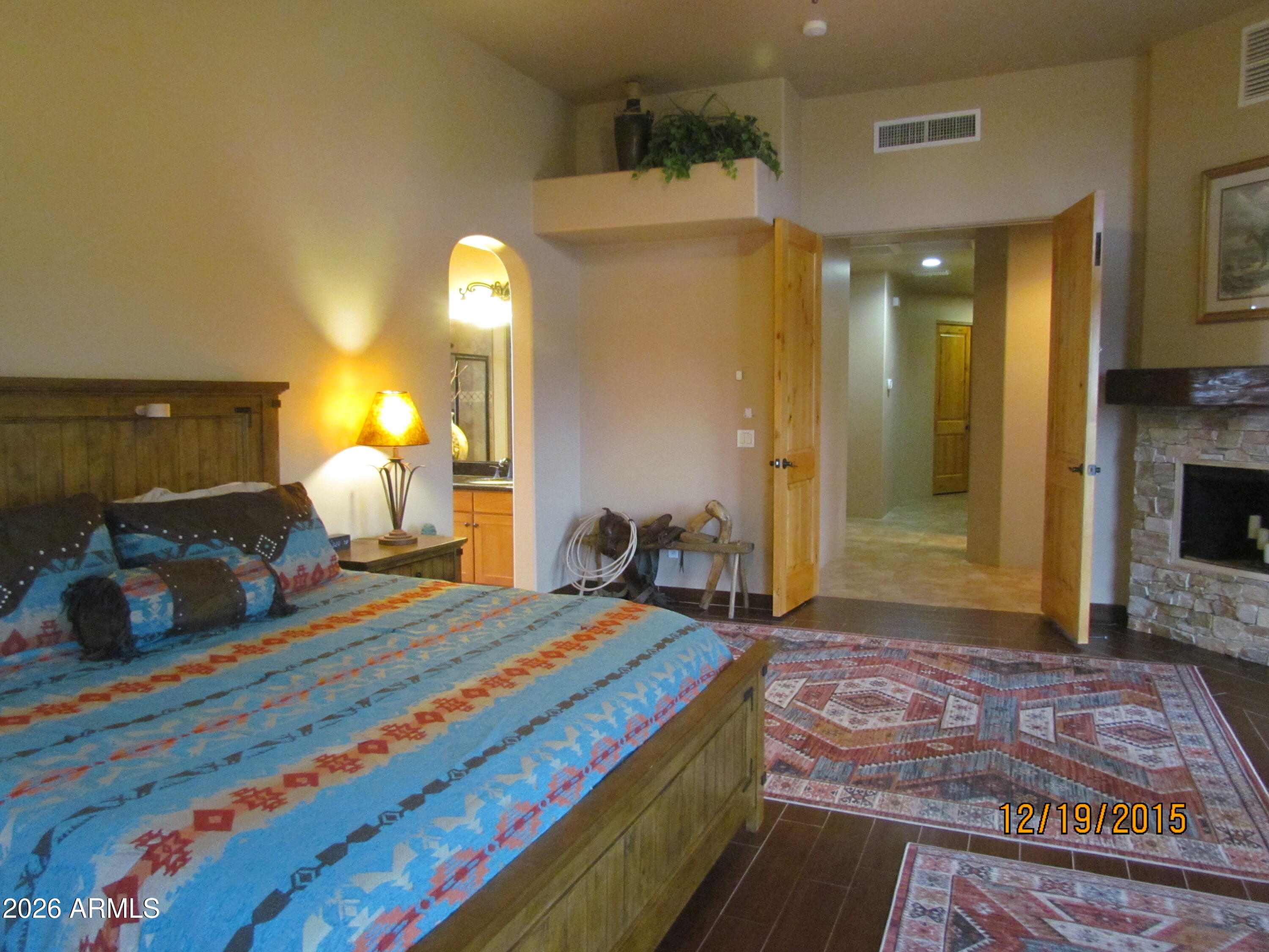 30012 North 170th Street Rio Verde, AZ 85263 - Photo 9 of 32 a bedroom with a bed and a large mirror on the dresser