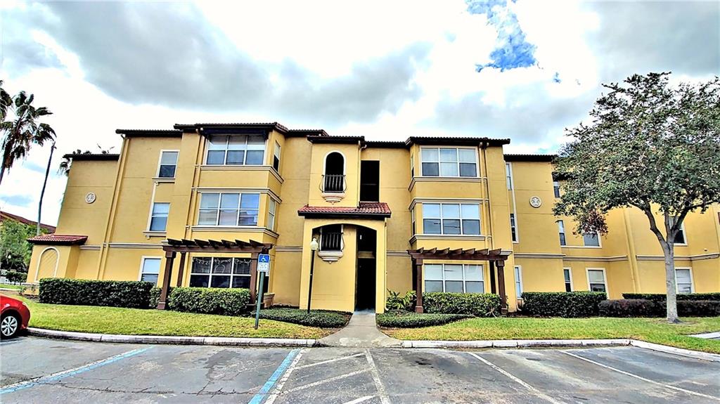 5164 Conroy Road, Unit 1513 Orlando, FL 32811 - Photo 1 of 1 a front view of residential houses with yard