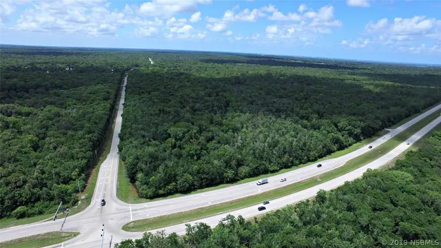 a view of a field with an outdoor space