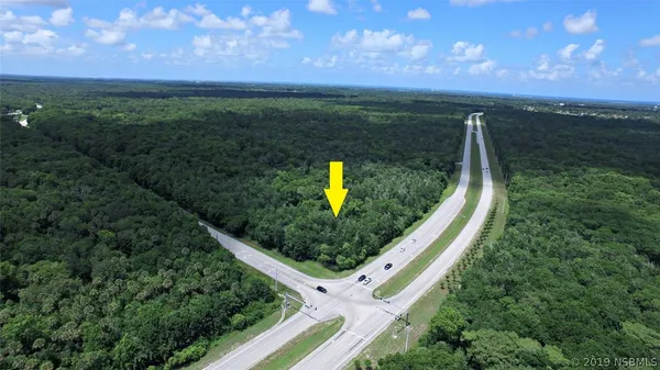 a view of a garden from a balcony