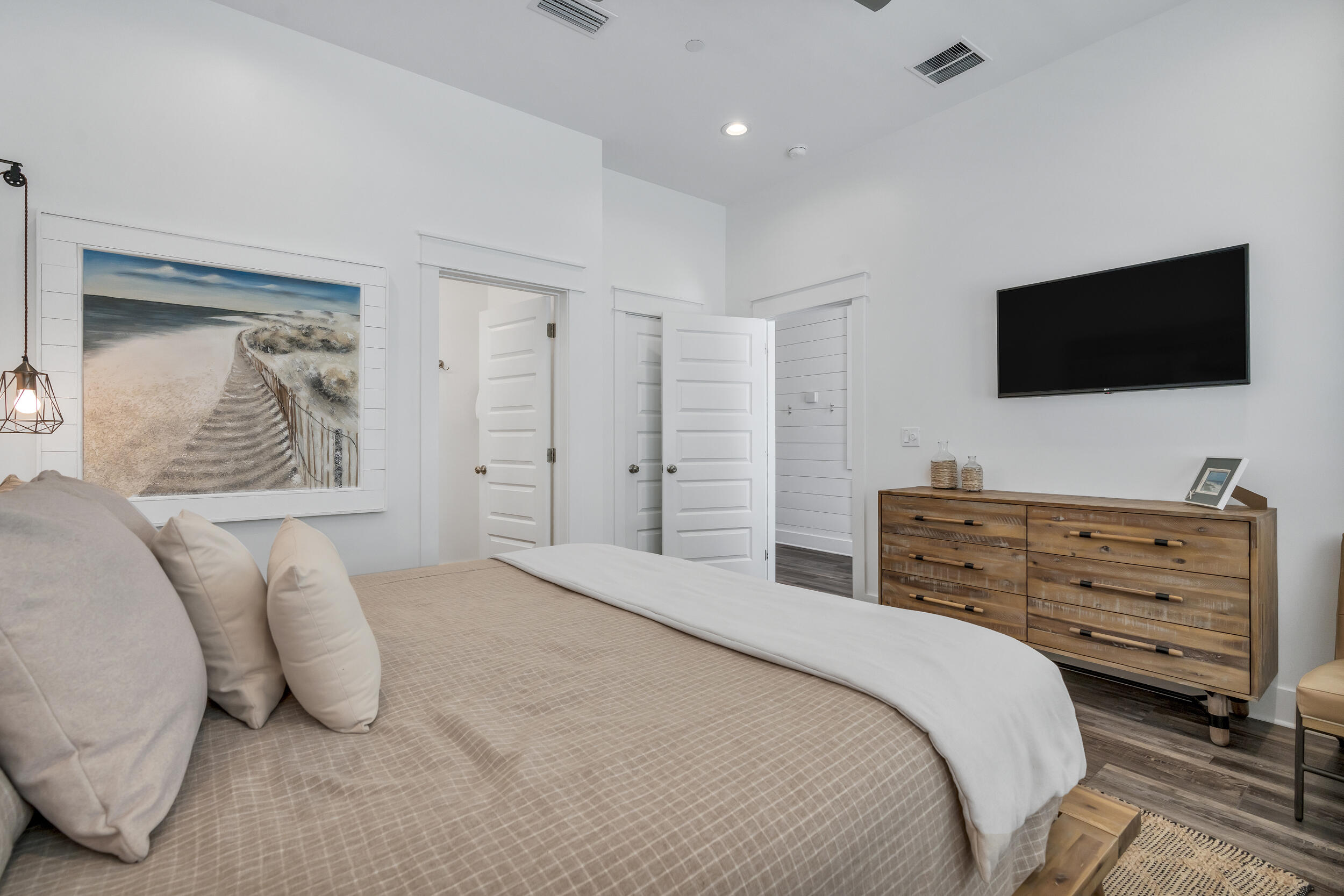 88 Pompano Street Destin, FL 32541 - Photo 19 of 109 a bedroom with a bed and a flat screen tv