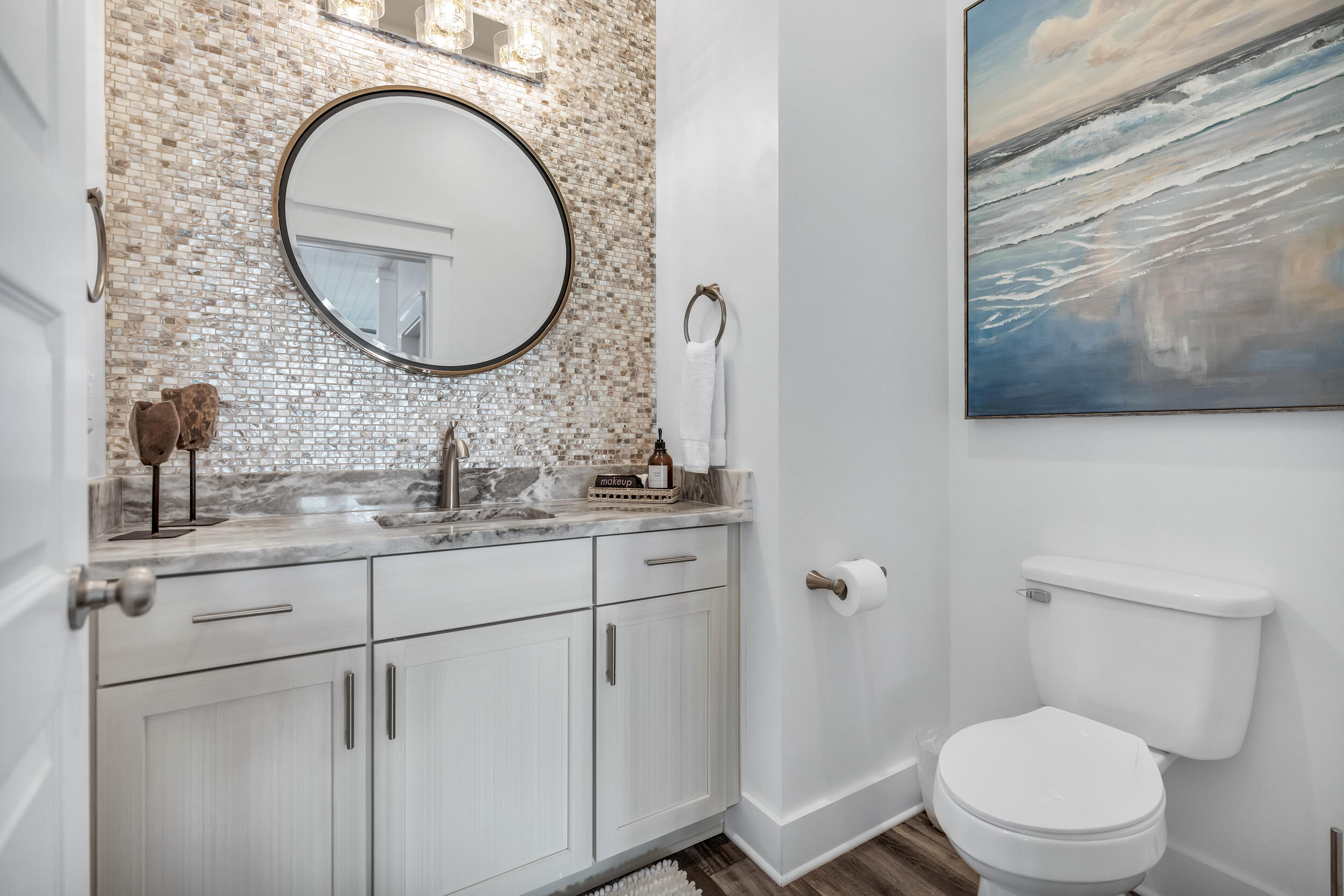 88 Pompano Street Destin, FL 32541 - Photo 23 of 109 a bathroom with a toilet a sink and a mirror