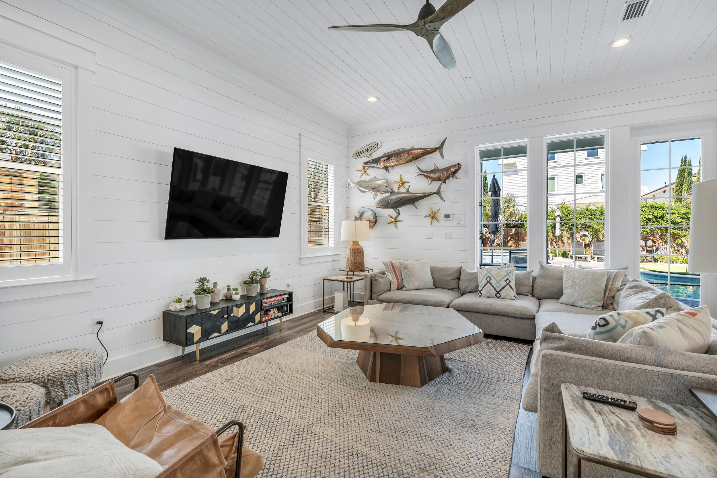 88 Pompano Street Destin, FL 32541 - Photo 40 of 109 a living room with furniture fireplace and a flat screen tv