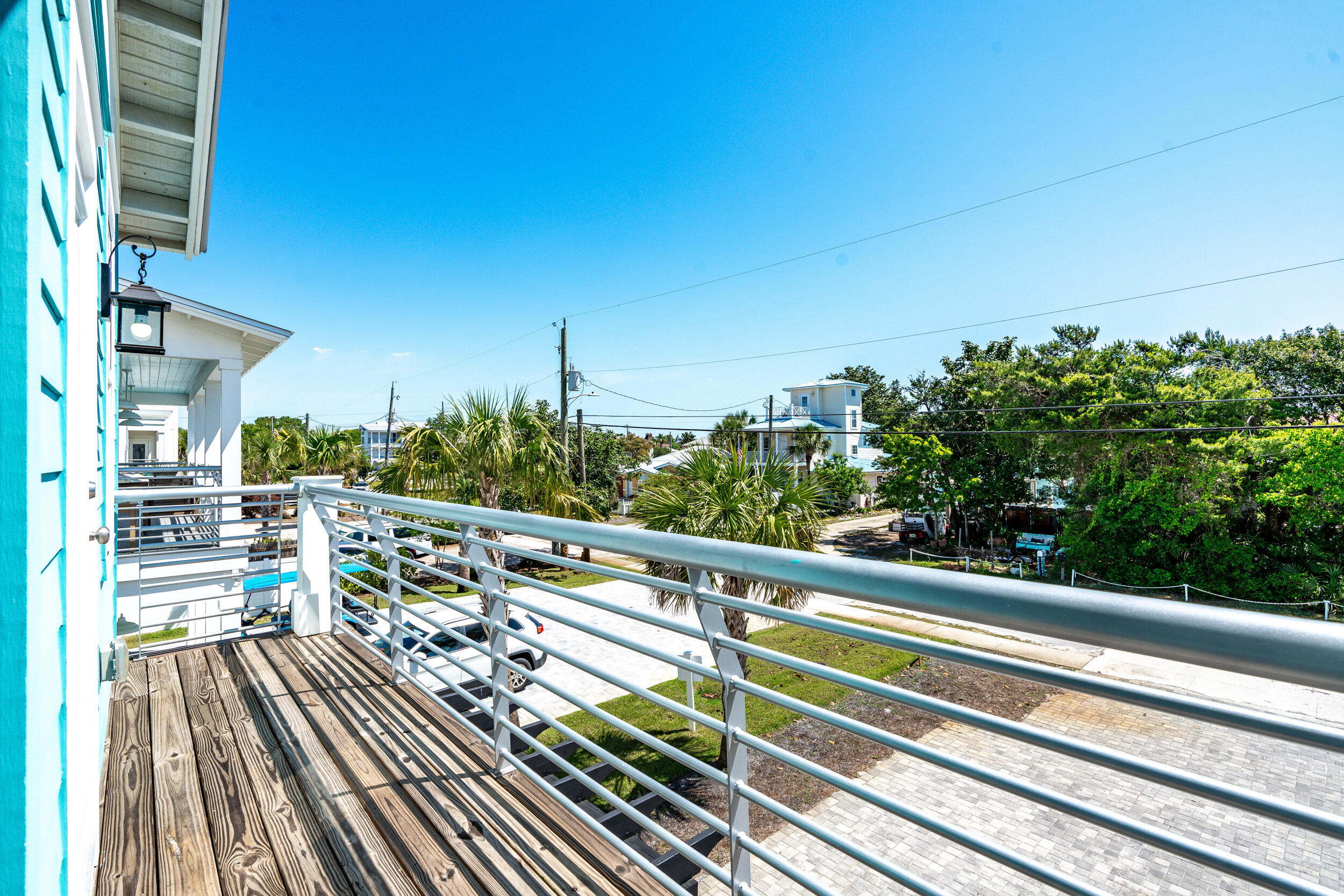 88 Pompano Street Destin, FL 32541 - Photo 58 of 109 a view of balcony with wooden floor and outdoor seating