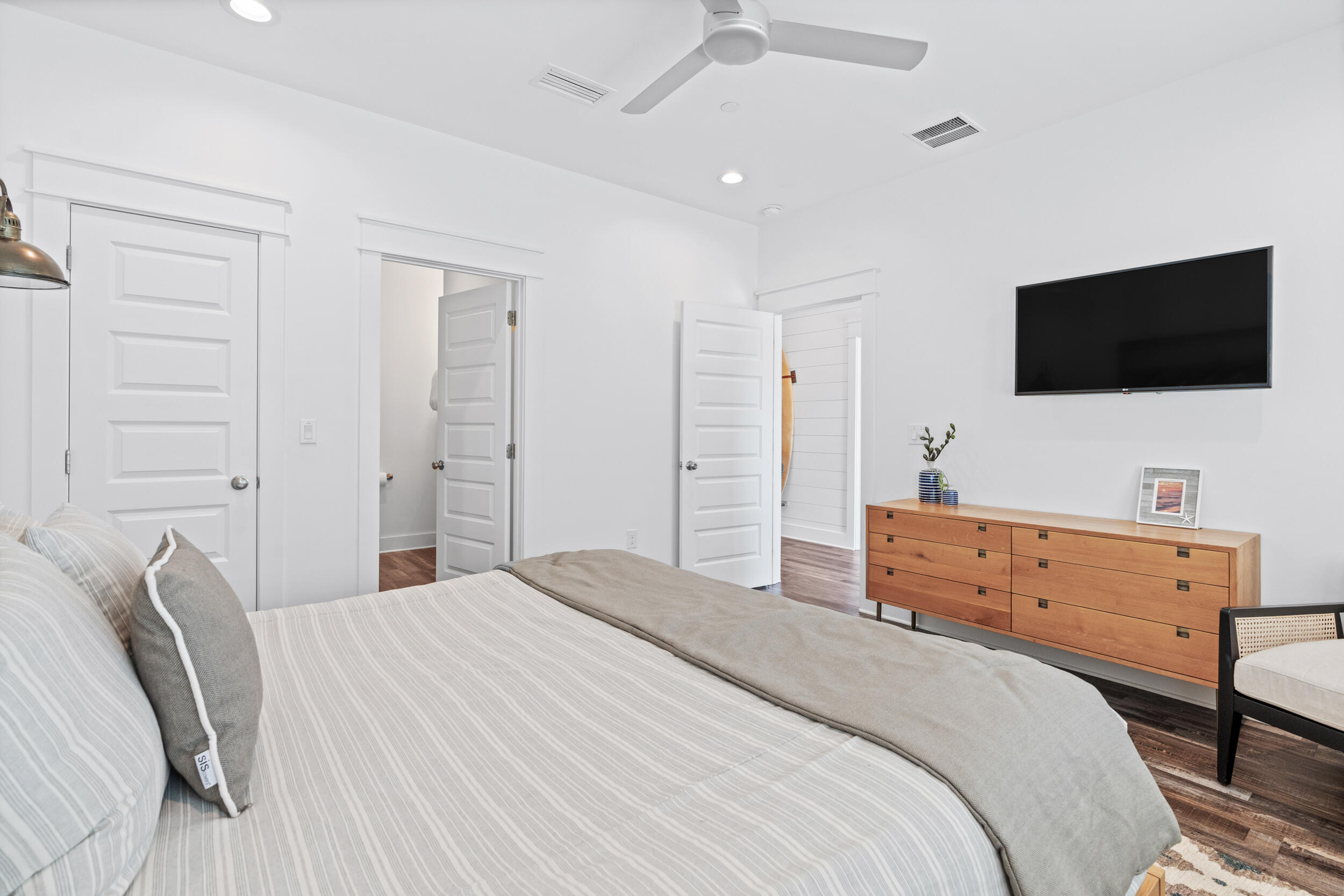 88 Pompano Street Destin, FL 32541 - Photo 60 of 109 a bedroom with a bed and a flat screen tv