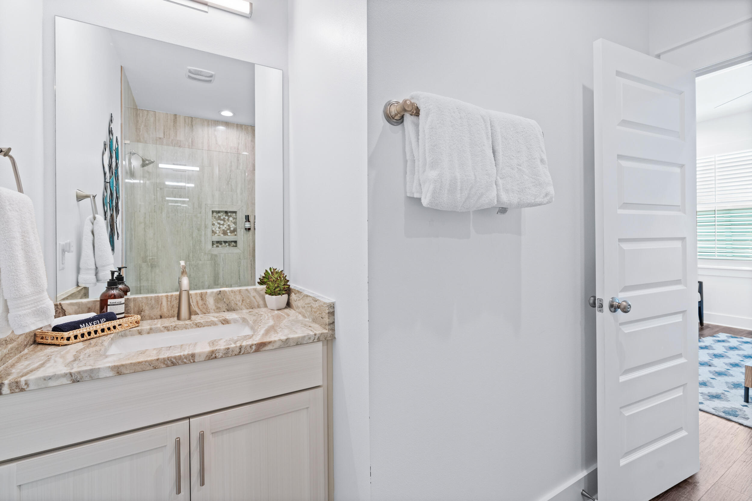 88 Pompano Street Destin, FL 32541 - Photo 62 of 109 a bathroom with a granite countertop sink and a mirror