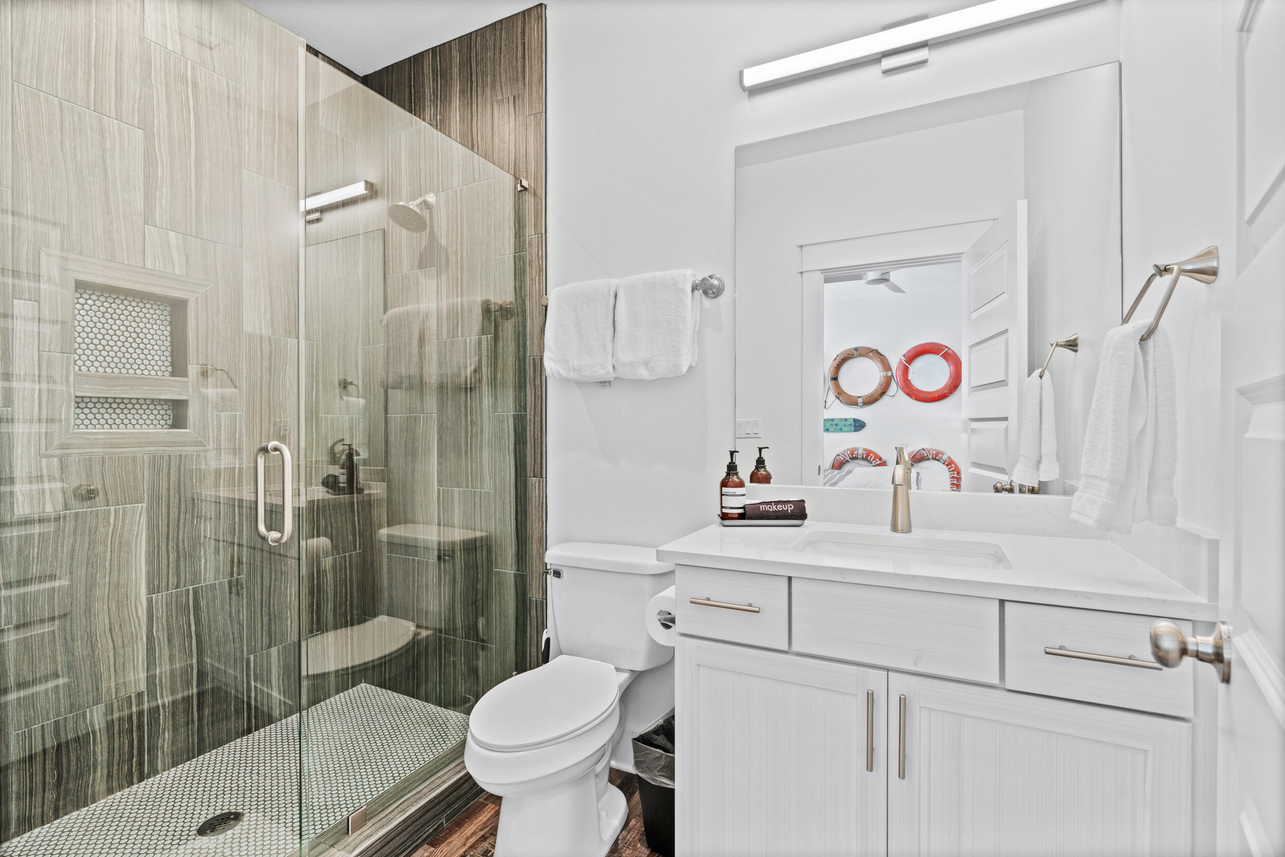 88 Pompano Street Destin, FL 32541 - Photo 65 of 109 a bathroom with a sink vanity mirror and toilet