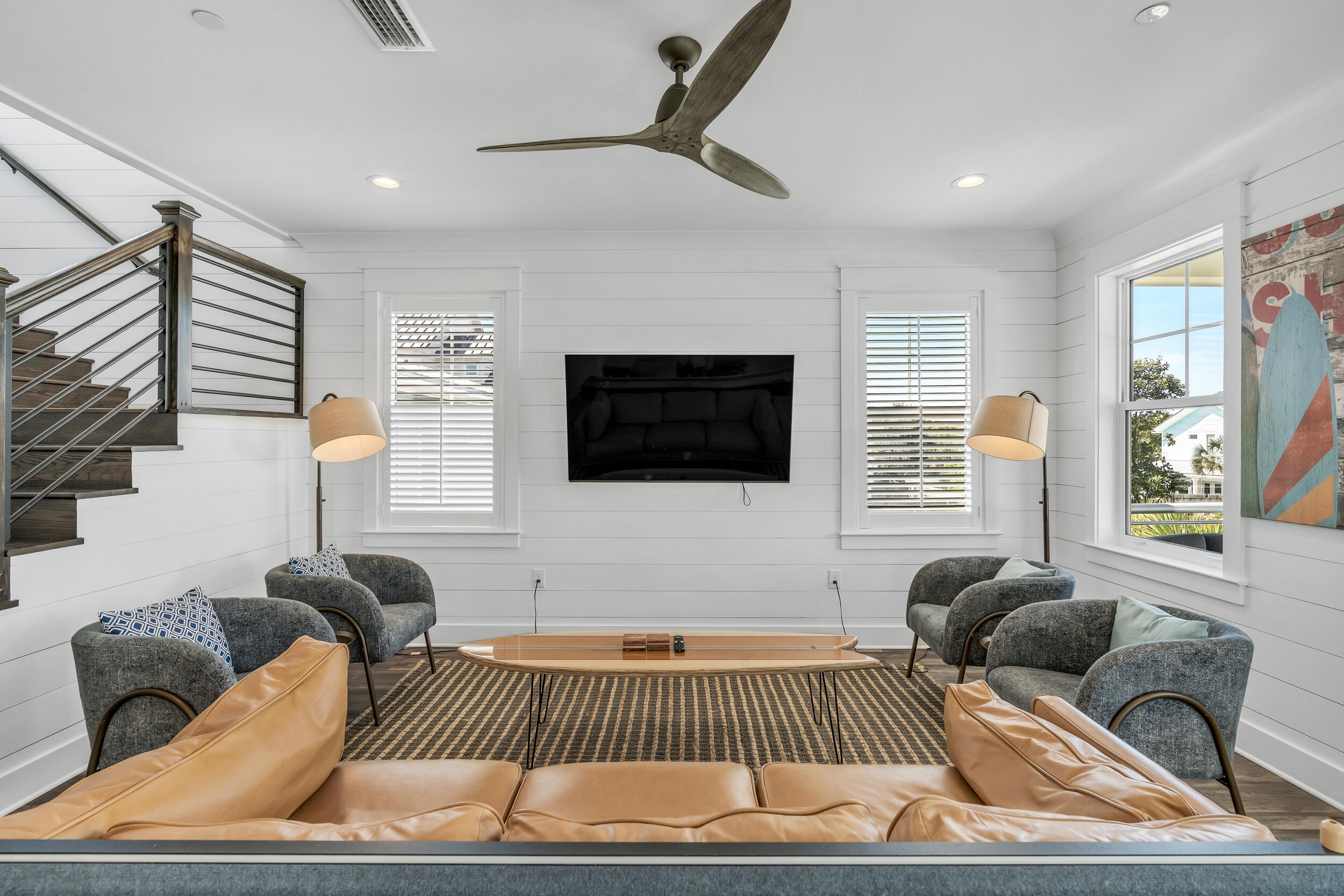 88 Pompano Street Destin, FL 32541 - Photo 69 of 109 a living room with furniture and a flat screen tv