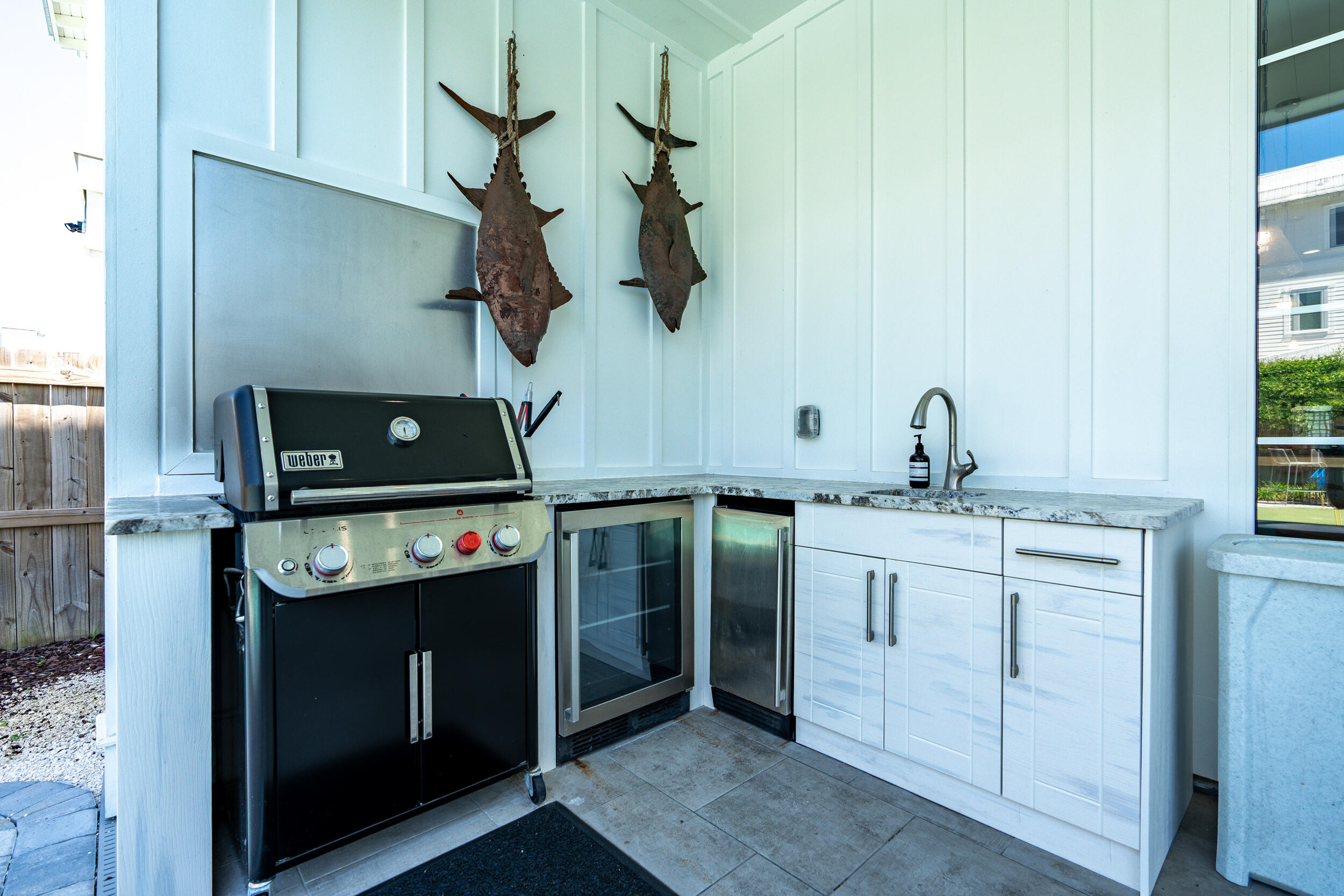 88 Pompano Street Destin, FL 32541 - Photo 7 of 109 a kitchen with a stove and a sink